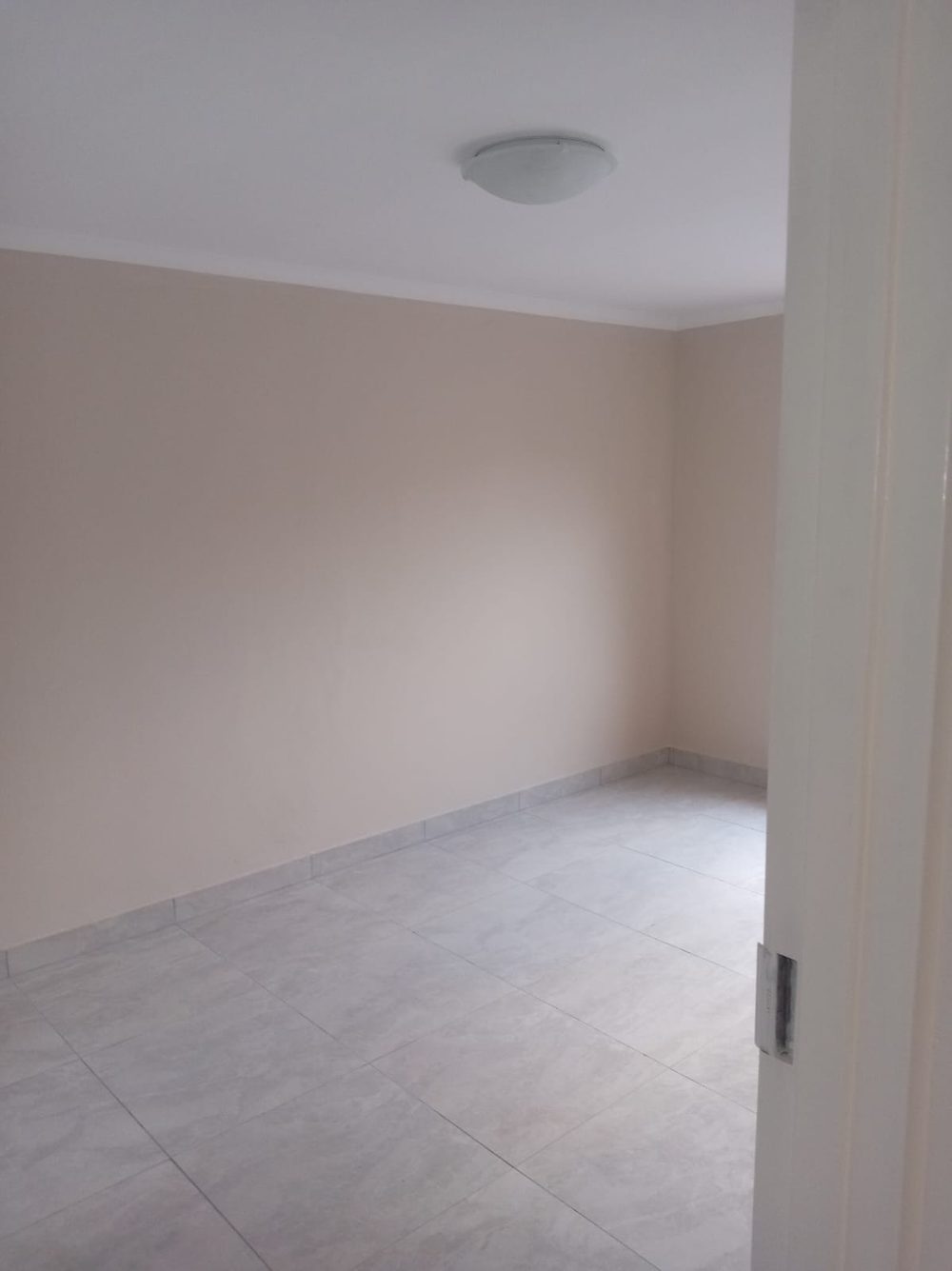 Freshly tiled and painted room